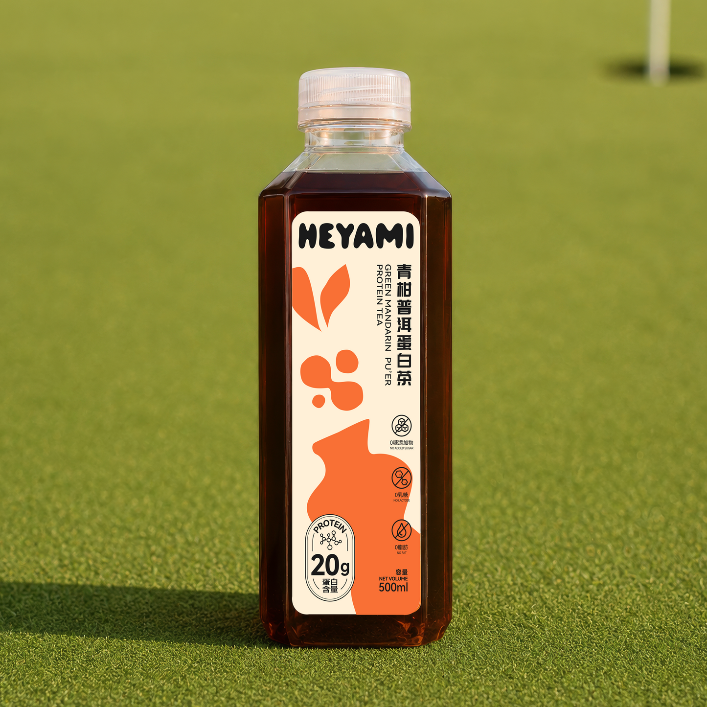 Bottle of HEYAMI Green Mandarin Puer Protein Tea on a green grass background